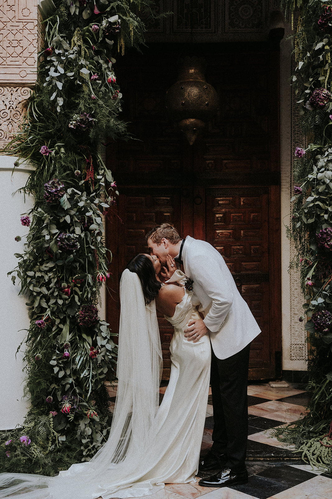el fenn wedding, man and woman under floral arch