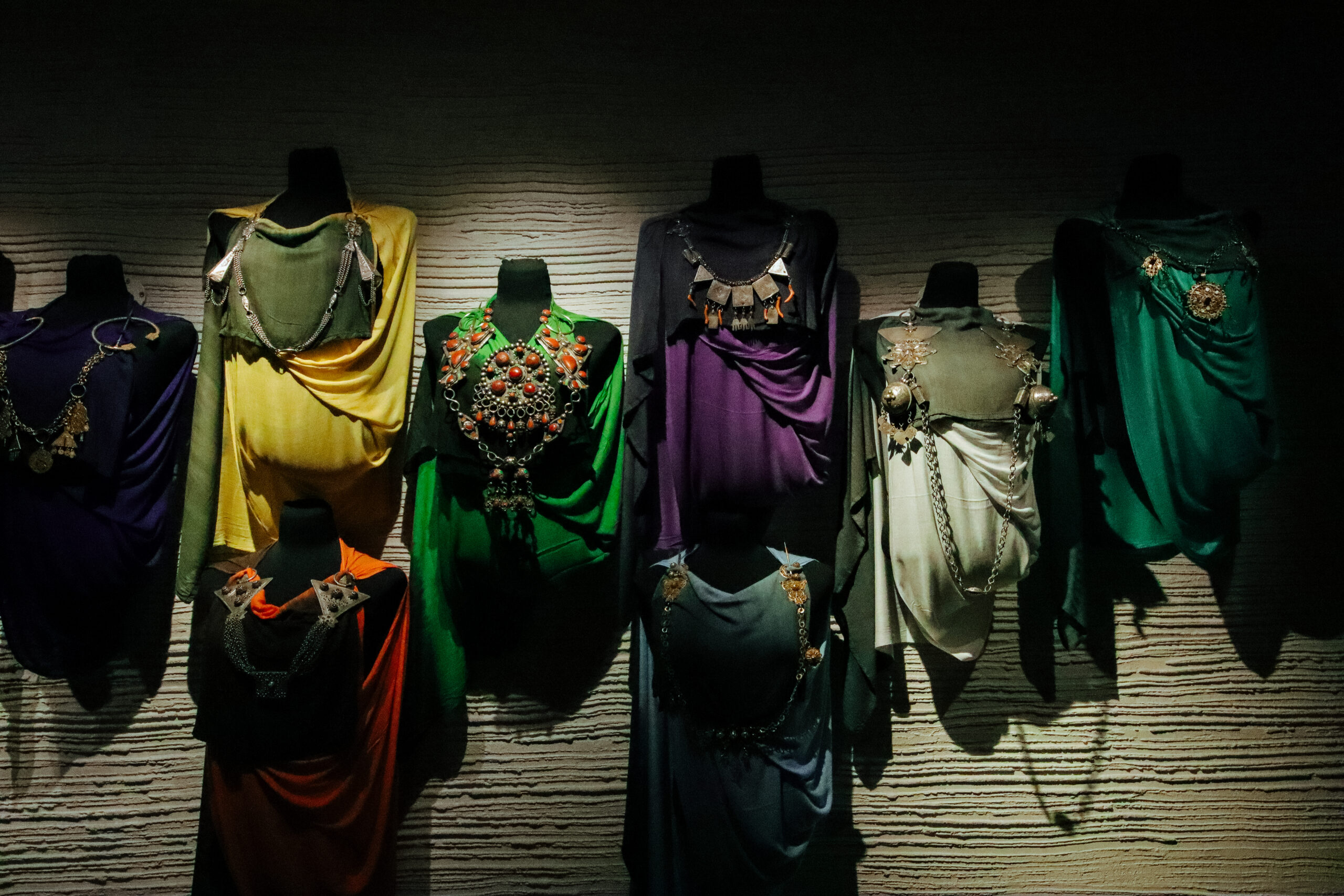 african jewellery displayed in colourful clothing