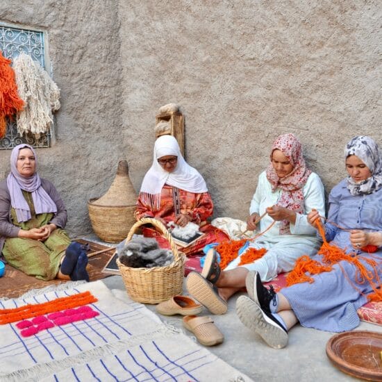 lady weavers working on moroccan rugs